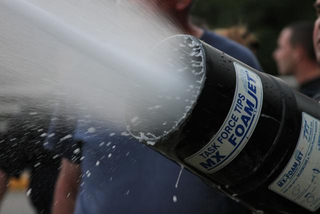 Foam nozzle on handline in operation