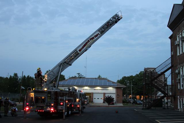 Truck 6 being raised at the school administration building during ladder operations training on May 13, 2011.